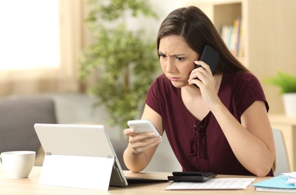 woman on the phone with insurance after getting a scam call